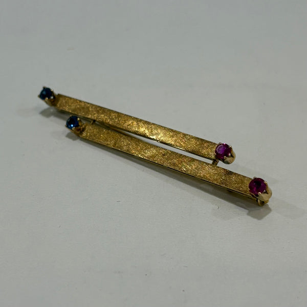 Feuer und Eis Brosche - 750er Goldbrosche mit Saphir und Rubin