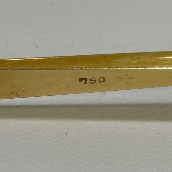 Goldbrosche mit Brillant umgeben von Rubinen
