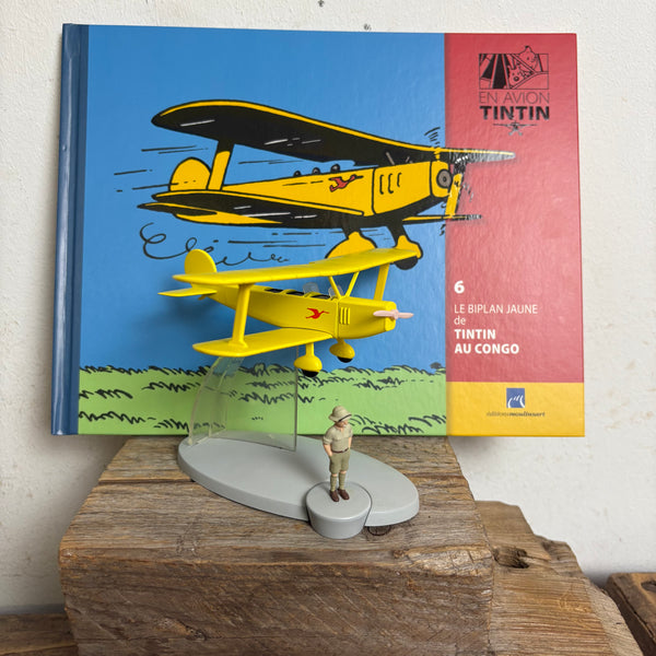 Modell Figur und Buch Tim und Struppi der Gelbe Doppeldecker mit Tim aus Tim im Kongo