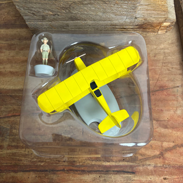 Modell Figur und Buch Tim und Struppi der Gelbe Doppeldecker mit Tim aus Tim im Kongo