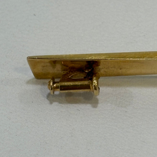 Goldbrosche mit Brillant umgeben von Rubinen