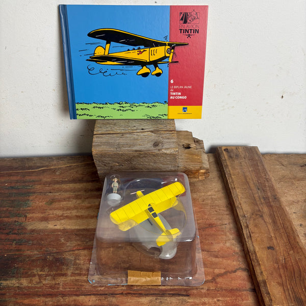 Modell Figur und Buch Tim und Struppi der Gelbe Doppeldecker mit Tim aus Tim im Kongo