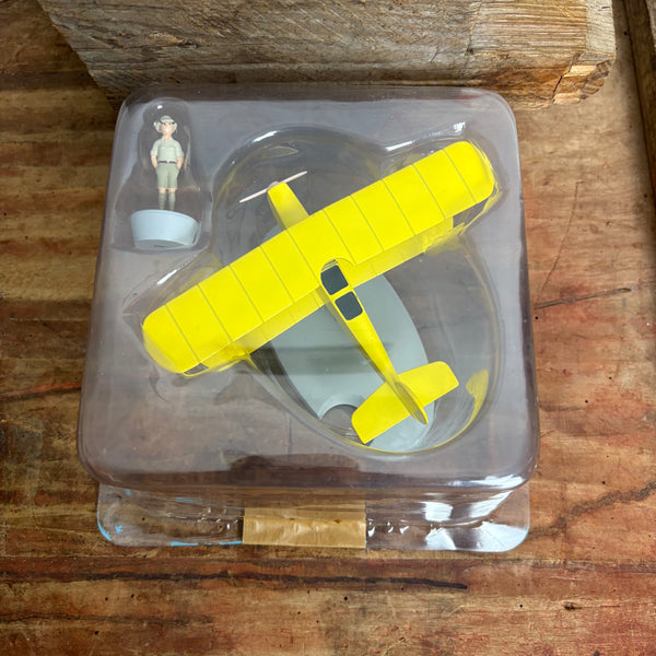 Modell Figur und Buch Tim und Struppi der Gelbe Doppeldecker mit Tim aus Tim im Kongo