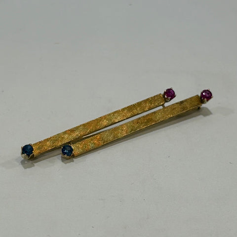Feuer und Eis Brosche - 750er Goldbrosche mit Saphir und Rubin