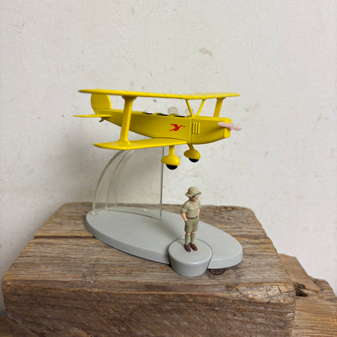 Modell Figur und Buch Tim und Struppi der Gelbe Doppeldecker mit Tim aus Tim im Kongo