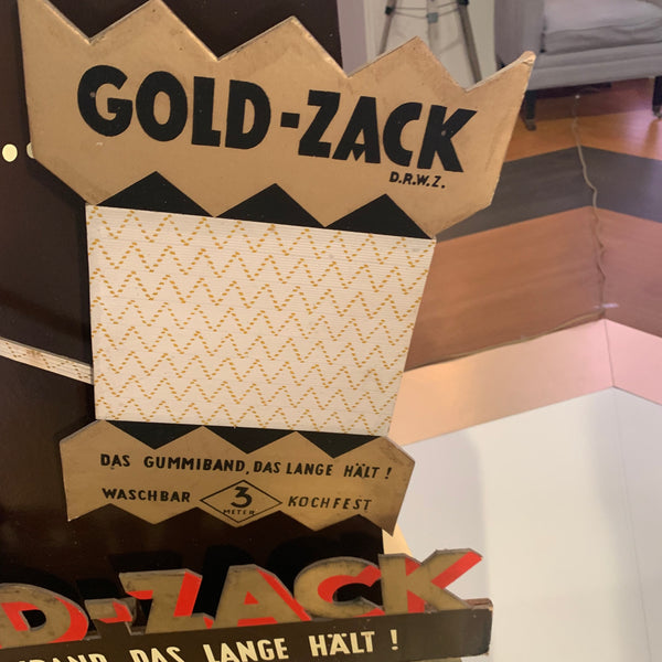 Werbeaufsteller der Marke Gold-Zack